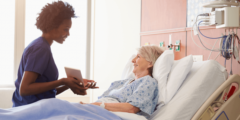 Nurse shows a patient how to use a HIPAA-compliant eSignature